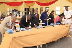 Oath taking and signing by the inductees during the 2nd Annual Conference of the College held in the Rafia City of Ikot Ekpene, Nigeria